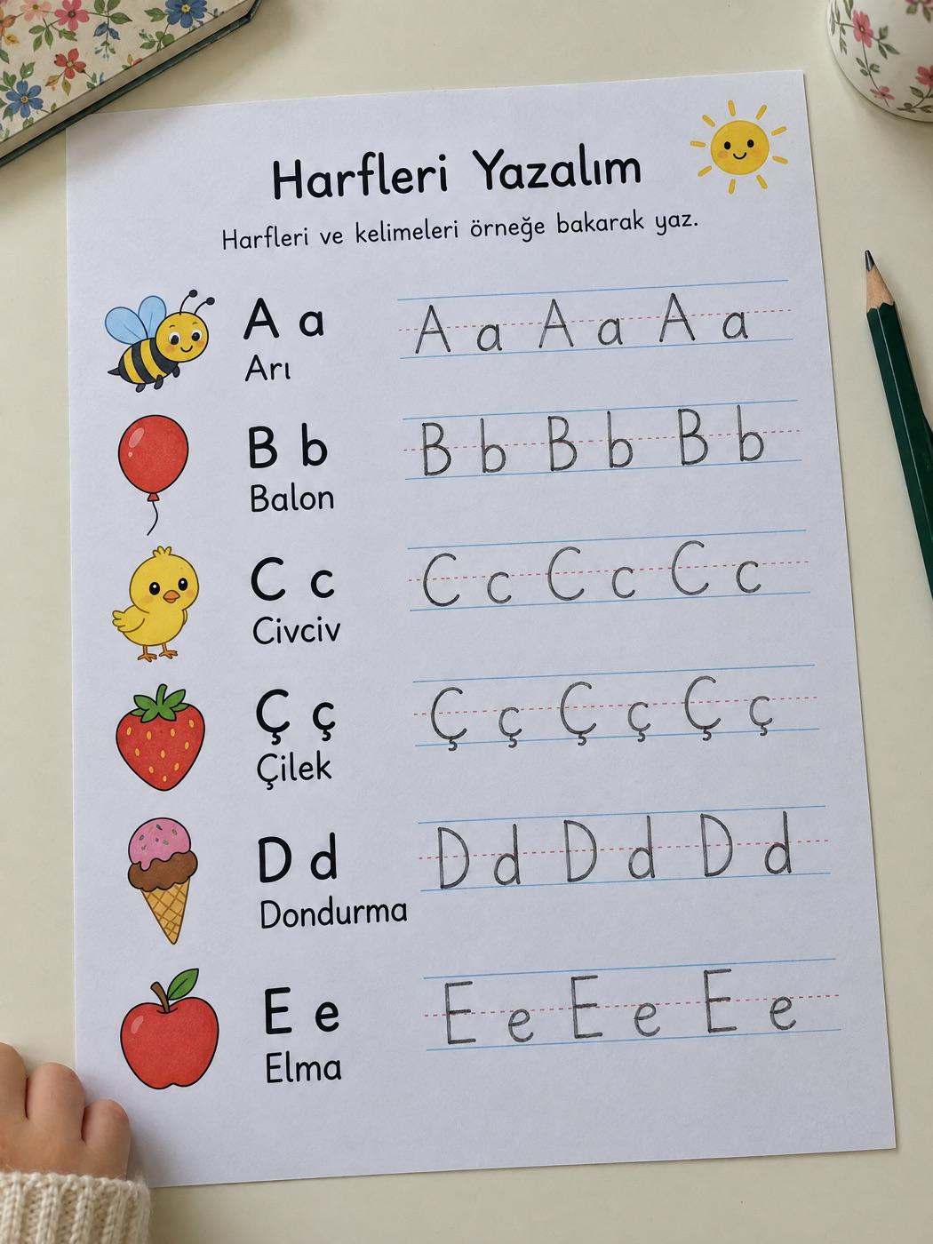 Çalışma kâğıdında kurşun kalemle düzgün ve düzenli yazılmış kelimeler ve cümleler (örnek görsel)